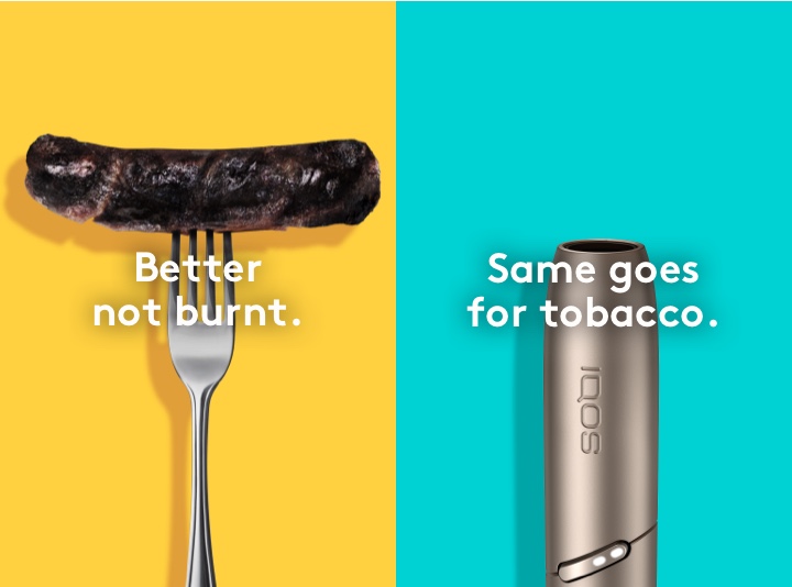 Burnt sausage on a fork compared to IQOS 3 DUO holder