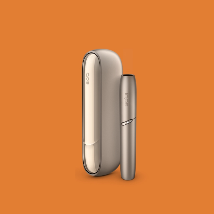 Brilliant gold IQOS 3 DUO holder with HEETS stick and charger