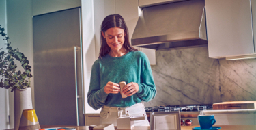 Girl unpacking her IQOS device