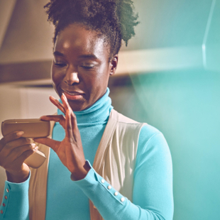 Girl showing a gold IQOS holder
